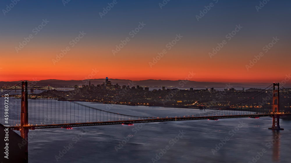 Sunrise at the Golden Gate Bridge over view area of the skyline and the city by the bay San Francisco Ca.