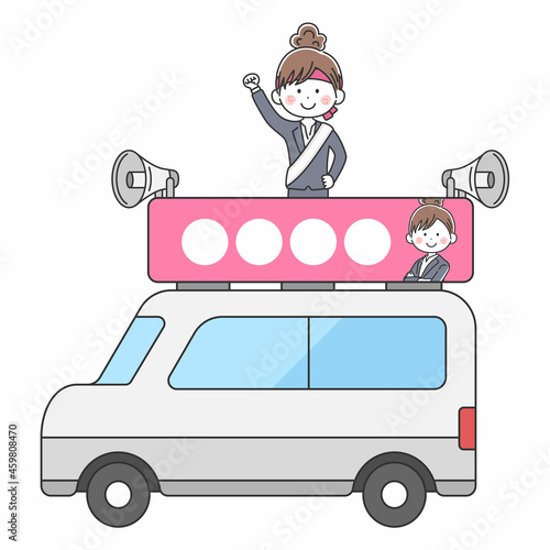 選挙カーで遊説する女性の立候補者