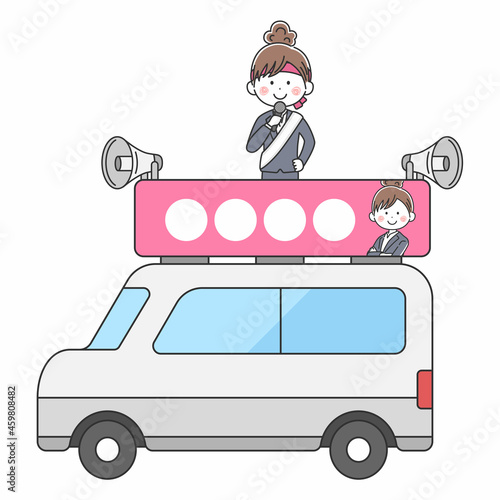 選挙カーで遊説する女性の立候補者