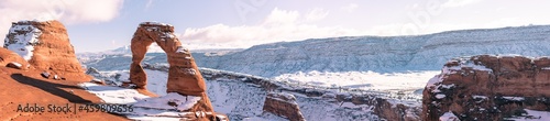 Delicate Arch panorama in winter snow