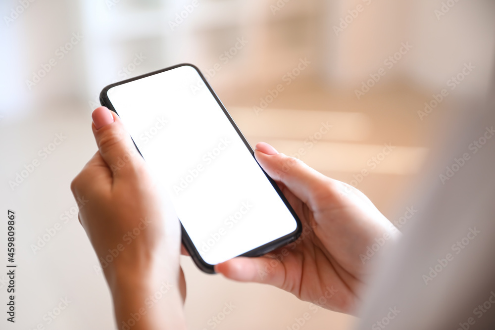 Woman with mobile phone in office, closeup Woman with mobile phone in office, closeup