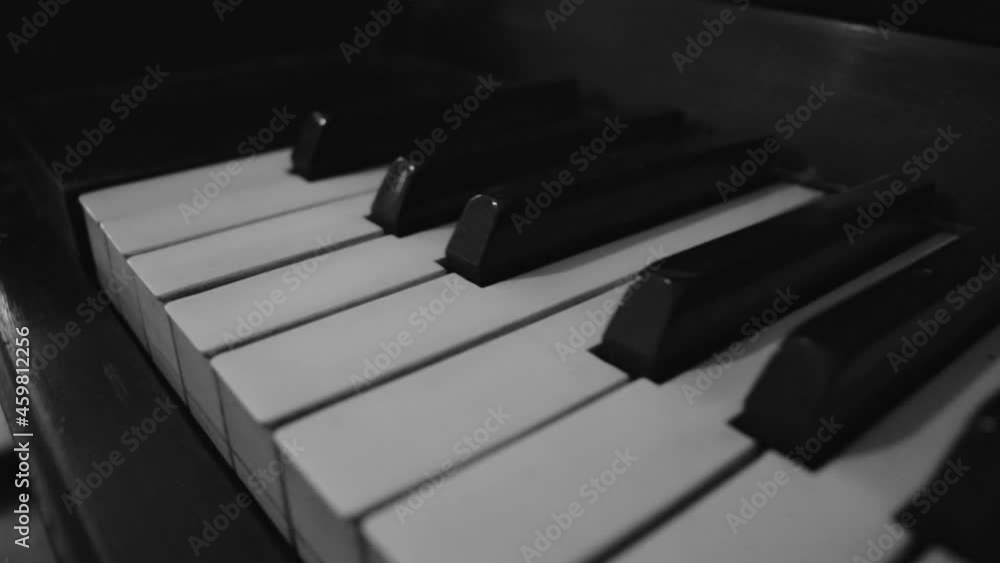 monochrome old piano keyboard in close up. black and white musical instrument monochrome old piano keyboard in close up. black and white musical instrument