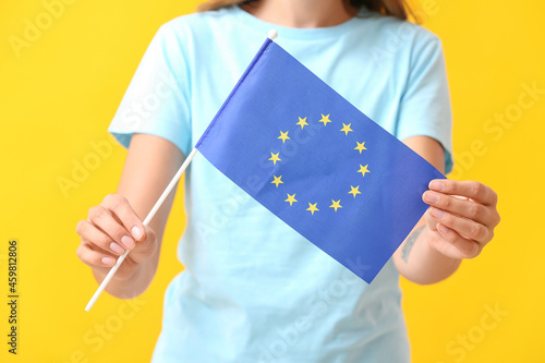 Young woman with flag of Eu...
