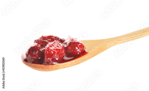 Wooden spoon with tasty dogwood jam on white background, closeup