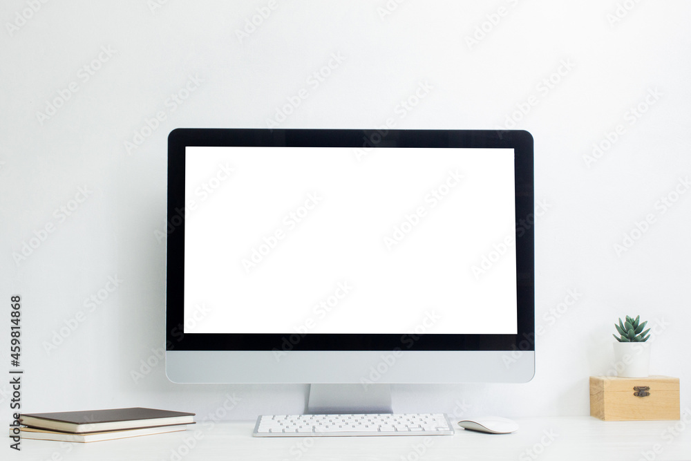 A mock up computer with notebook and cautus on table. A mock up computer with notebook and cautus on table.
