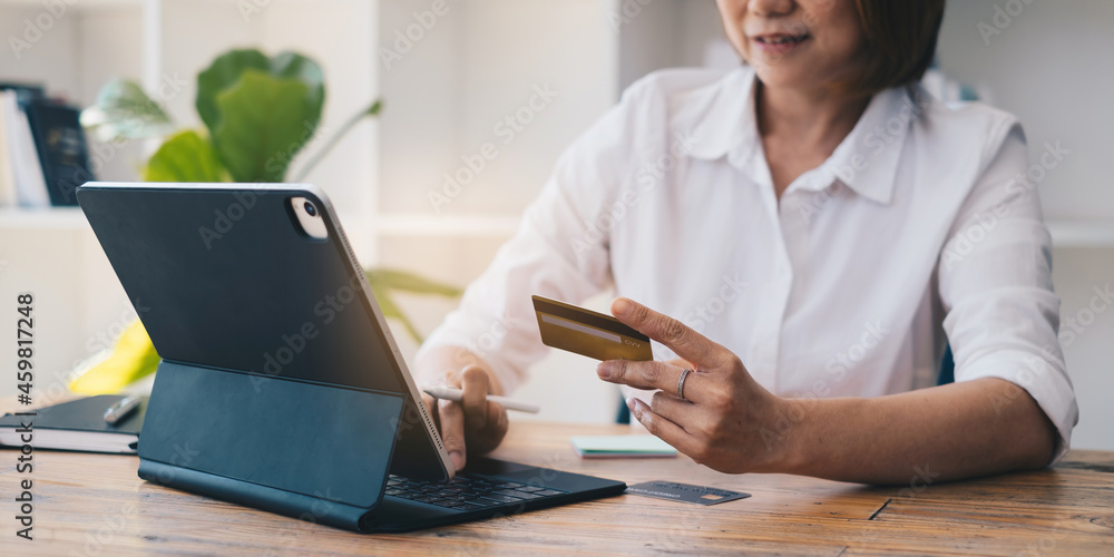 Woman enjoy with online shopping application and typing credit card for fill number to payment. Woman enjoy with online shopping application and typing credit card for fill number to payment.