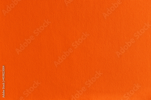 bright orange fabric background. ribbed texture. seamless pattern of textile