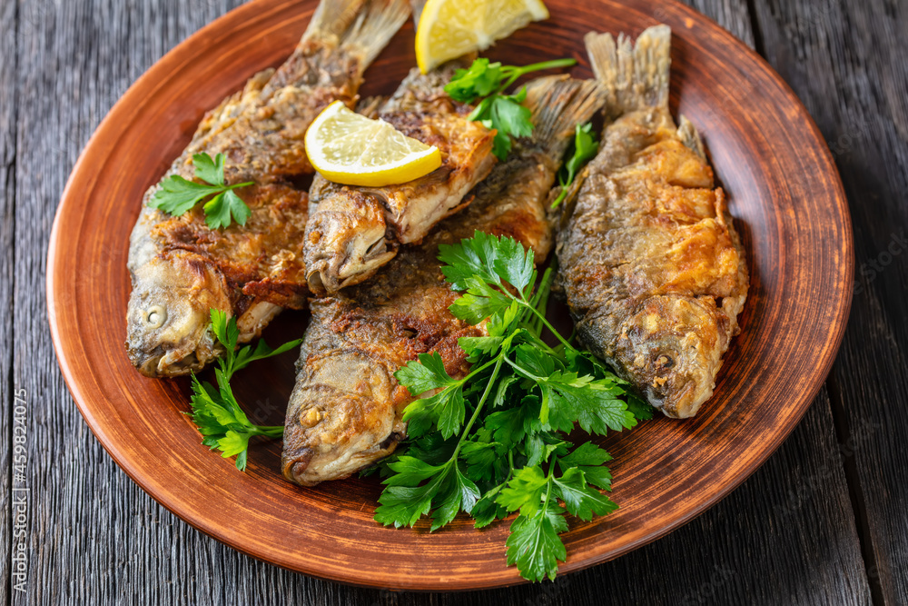fried crucian carps with golden crispy crust fried crucian carps with golden crispy crust