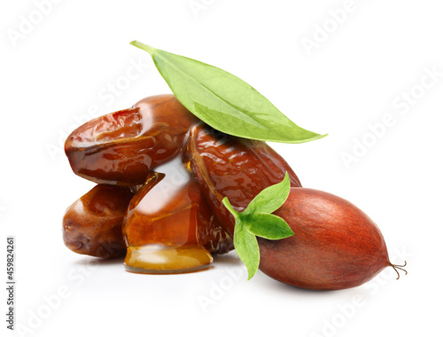 Jojoba oil on seeds isolated on white background photo