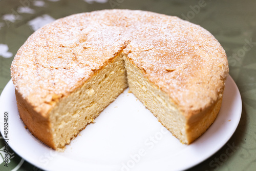Incomplete round santiago cake with sugar sprinkled on top