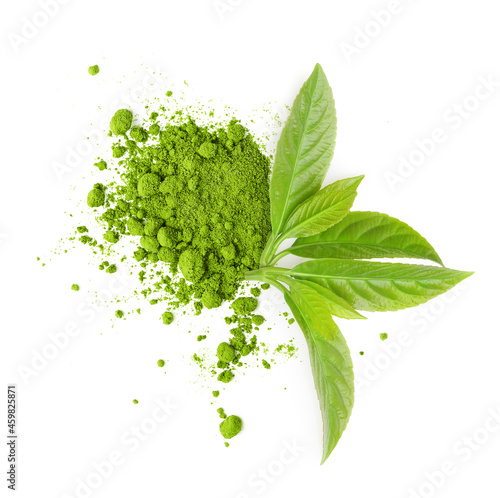 Tea matcha powder and green leaves isolated on white photo