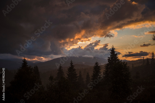 Scenic view of majestic mountains with cloudy sky
