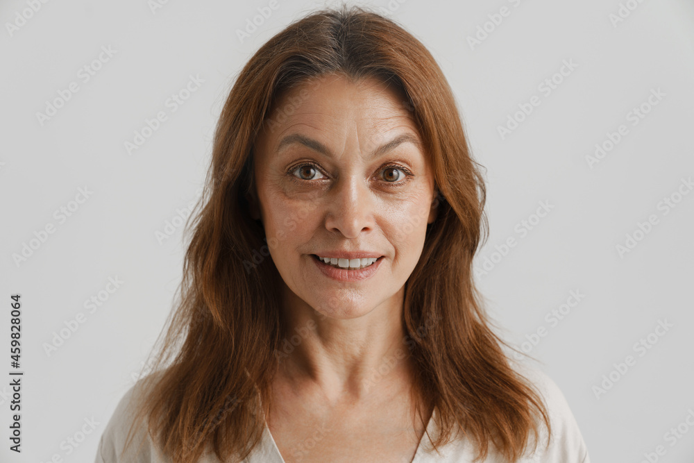 European ginger woman smiling and looking at camera European ginger woman smiling and looking at camera
