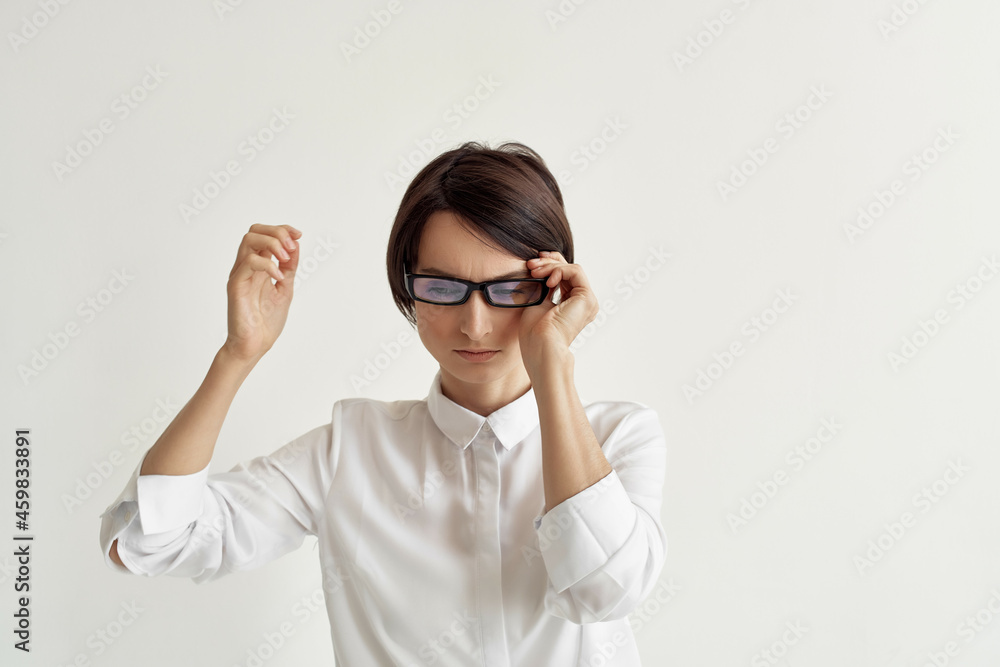 Businesswoman with glasses self-confidence light background Businesswoman with glasses self-confidence light background