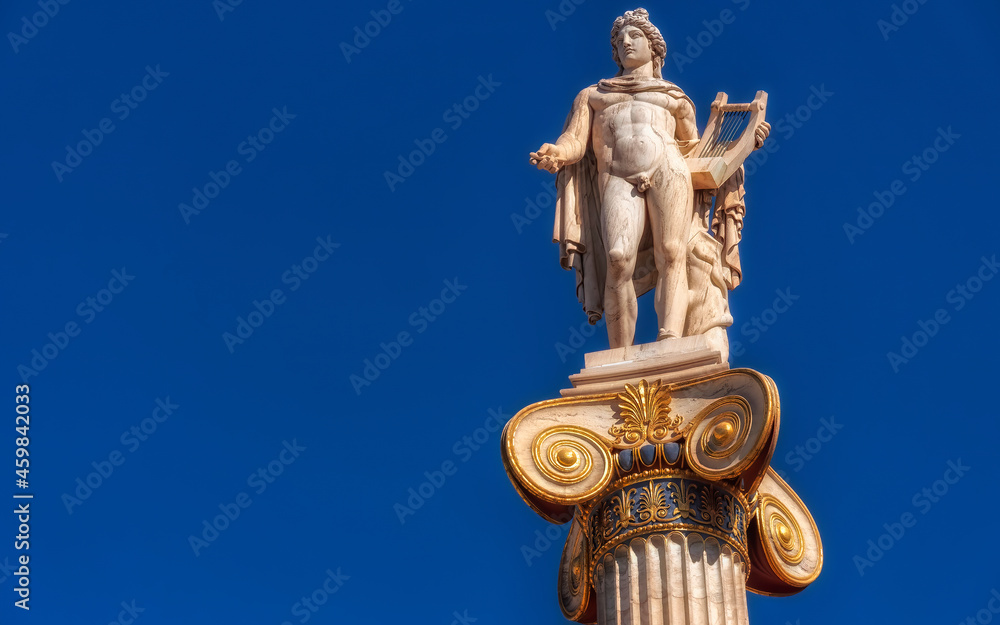 Apollo the ancient Greek god of poetry and music under blue sky with space for your text, Athens Greece