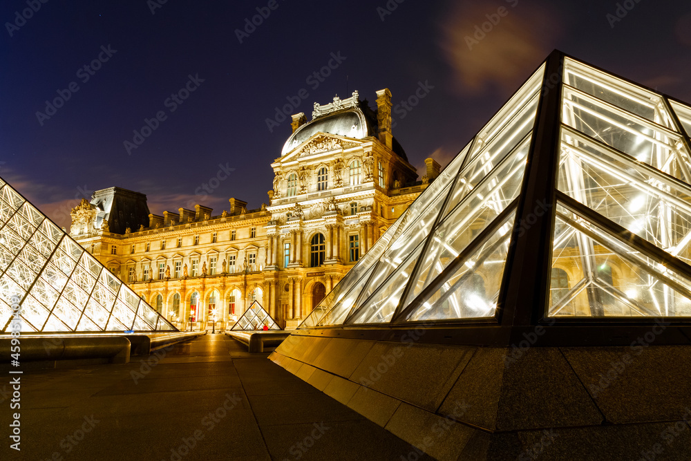 Paris, France July 25, 2016 Night scene of lit Louvre Pyramids