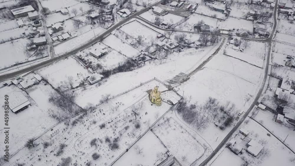 Rusty church domes view from above. The Orthodox Church in a small Moldavian village. Winter view. Rusty church domes view from above. The Orthodox Church in a small Moldavian village. Winter view.