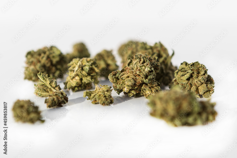 Marijuana pieces on isolated white background Marijuana pieces on isolated white background