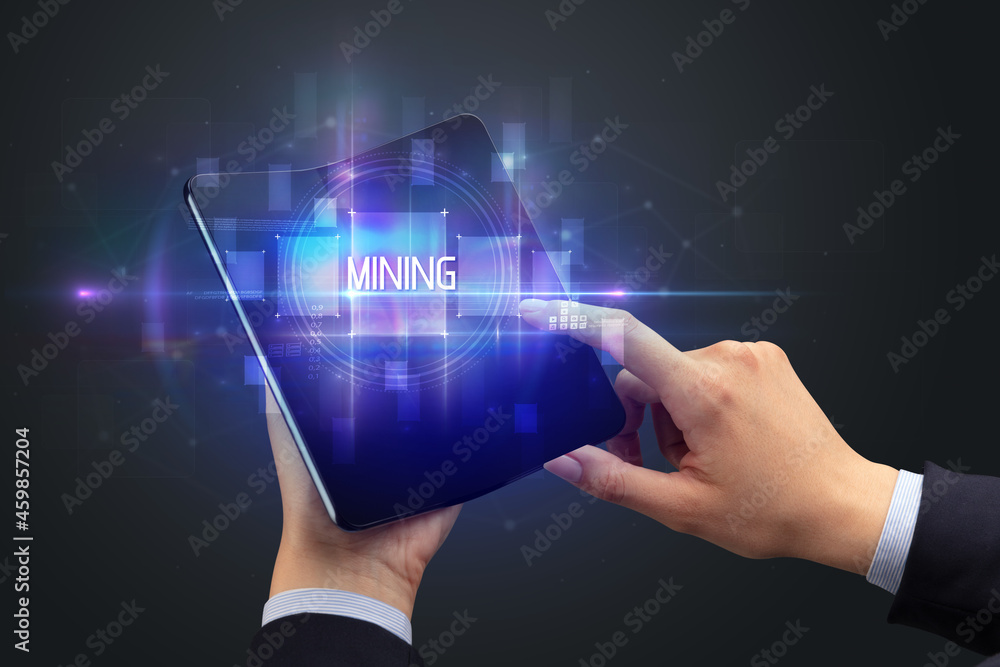 Businessman holding a foldable smartphone Businessman holding a foldable smartphone