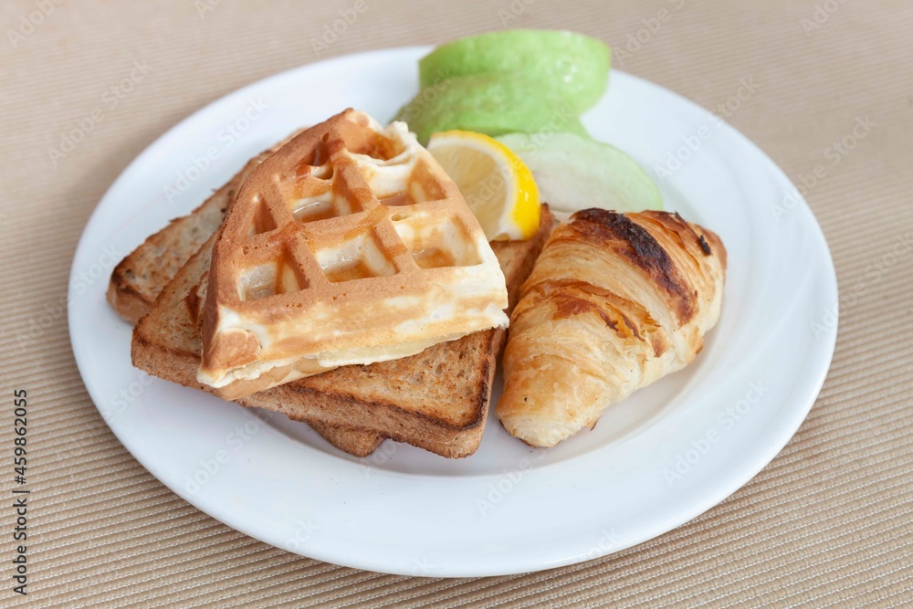 Western breakfast set, toast, croissants, waffles and fresh fruit Western breakfast set, toast, croissants, waffles and fresh fruit