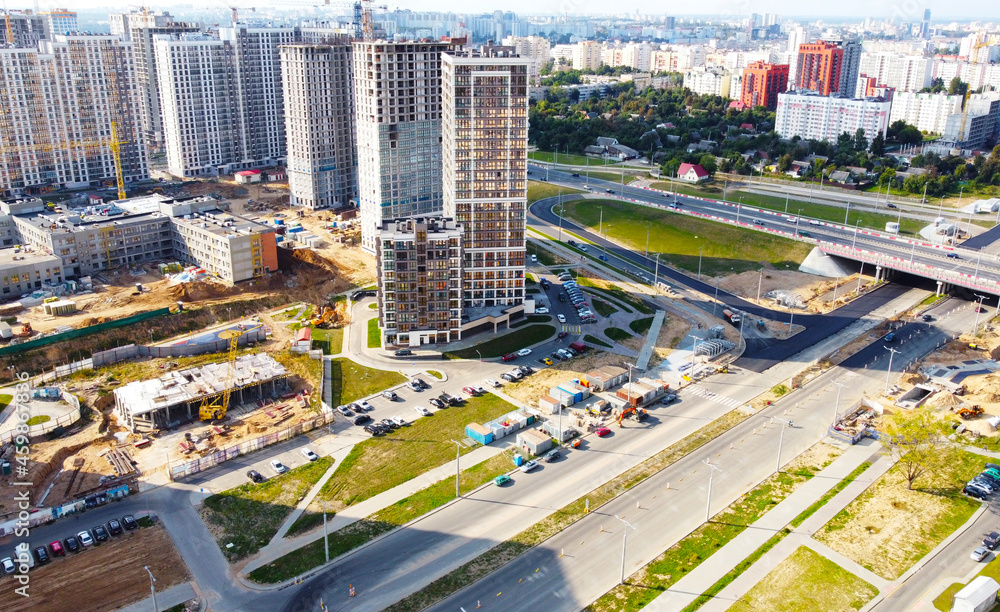 Fototapeta premium Top view of the construction of a new district of the city quarter with residential buildings and business centers. 25 September 2021, Minsk, Belarus