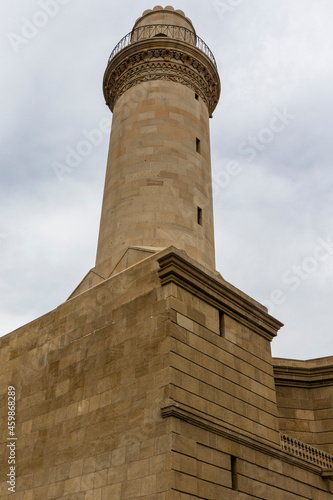 Facade of the Beyler mosque and minaret in the old city of Baku, Azerbeijan (Unesco World Heritage Site) photo