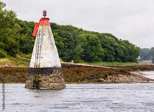 Conical concrete shipping navigation aid by the coast of Strangford Lough, County Down, Northern Ireland. photo