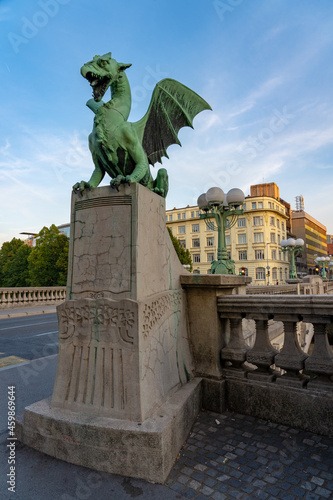 Dragon bridge in Ljubljana with dragon statue photo