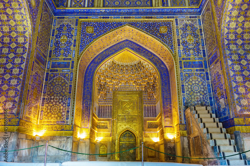 Details of Islamic architecture - mihrab and minbar. Tilya Kori Madrasah in Samarkand, Uzbekistan, XVII century. Walls are decorated with quotes from Quran photo