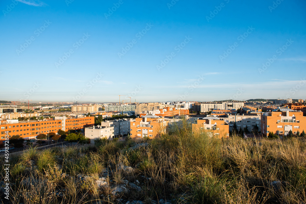 cityscape of buildings and houses at sunrise in Rivas Vaciamadrid and Rivas Futura in Madrid, Spain