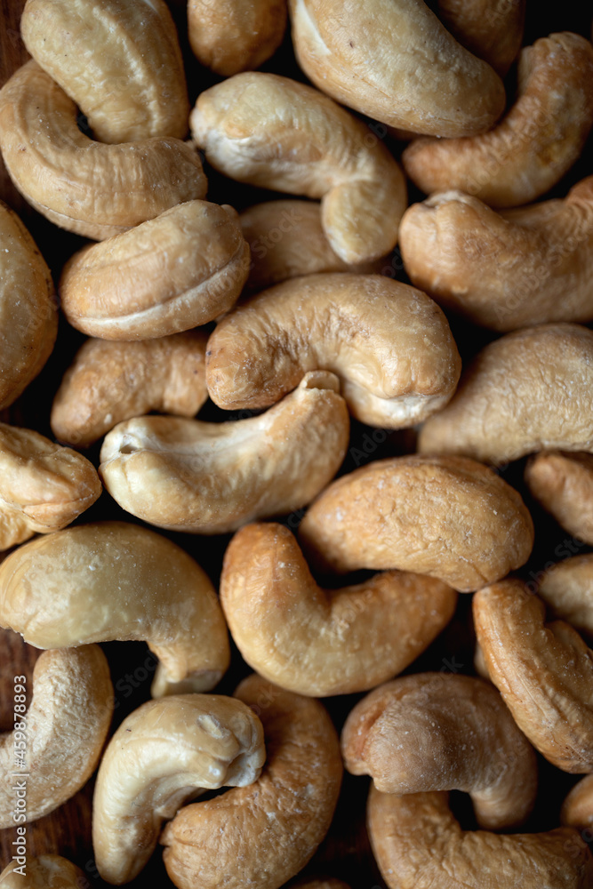 Tasty cashew nuts as background, top view Tasty cashew nuts as background, top view