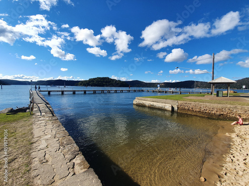 Footpath on the lakeshore against a cloudy sky photo