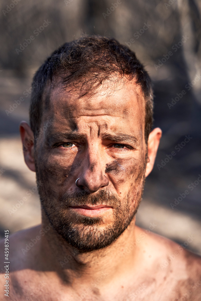 Man with ash and dirt on face Man with ash and dirt on face
