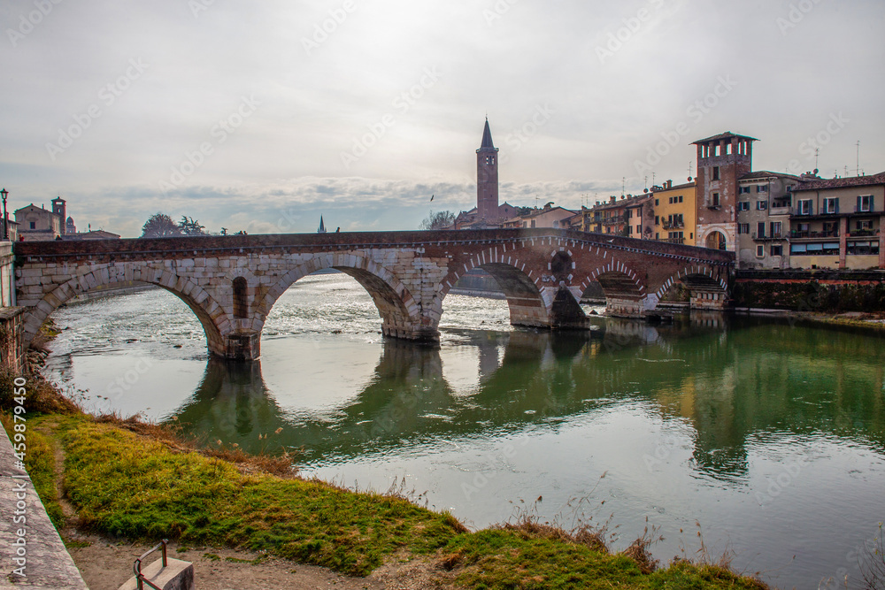 Ponte Pietra: Picturesque Roman arch bridge, built in 100 BC. NS. and rebuilt after World War II.  Verona city -  winter  vacations.
