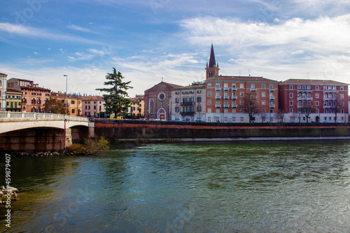 Fotografía Amazing  red brick Church close to  Ponte delle Navi in Verona asnd fine trees  - coniferous  trees!   Good winter day in Northern Italy