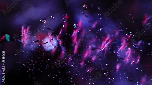 Dandelion blowing away with seeds in beautiful neon light