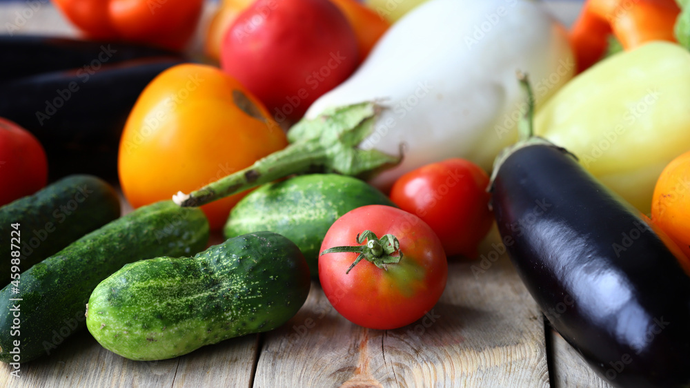 Set of farm vegetables on a wooden surface. Healthy food. Eco products. Set of farm vegetables on a wooden surface. Healthy food. Eco products.