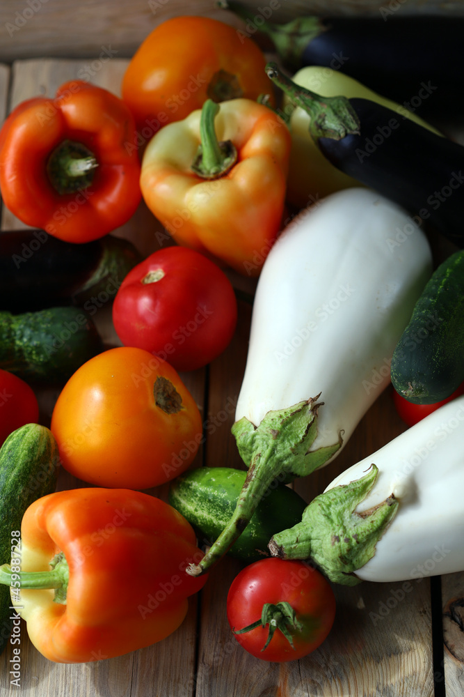 Set of farm vegetables on a wooden surface. Healthy food. Eco products.