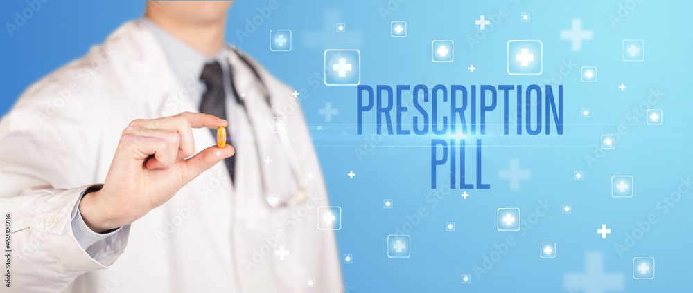 Close-up of a doctor giving a pill Close-up of a doctor giving a pill