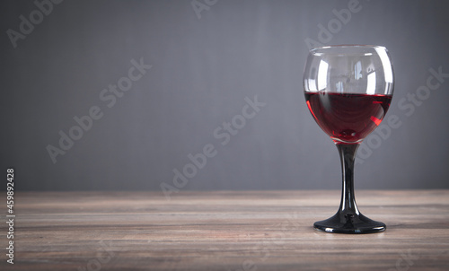 Glass of red wine on the table.