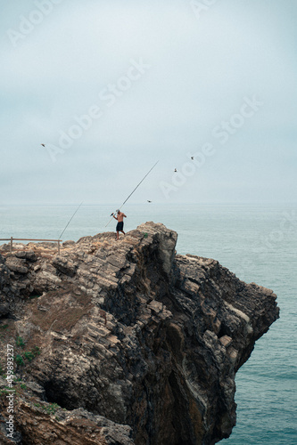 Fisherman on top of a Cliff on the Atlantic Coast