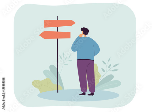 Man choosing direction of path way on road. Lost person standing in front of arrow signpost, making decision. Uncertainty, unknown future concept for banner, website design or landing web page