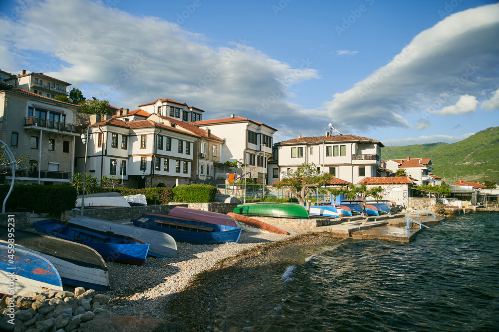 Colorful fishing boats on the shore of Ohrid lake in North Macedonia on a sunny day. High quality photo