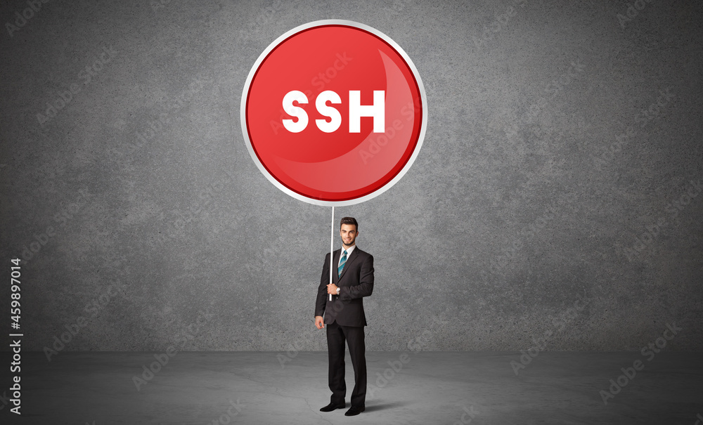 Fototapeta premium Young business person holdig traffic sign