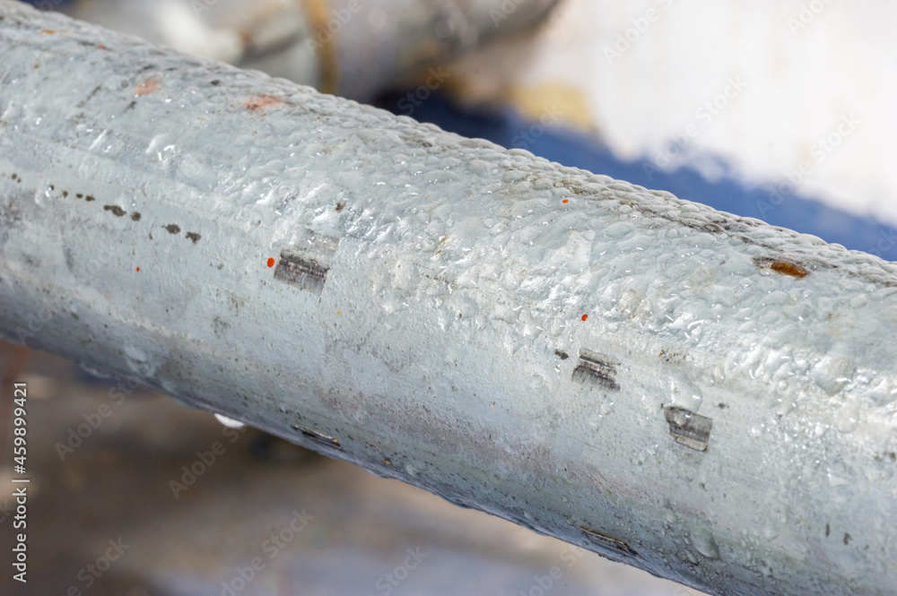 Condensed water on the steel pipe. Condensed water on the steel pipe.