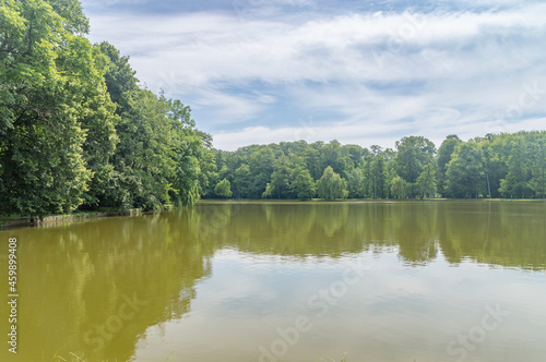 Fototapeta Naklejka Na Ścianę i Meble -  Potulicki pond in the Potulicki park at summer time in Pruszkow Poland.
