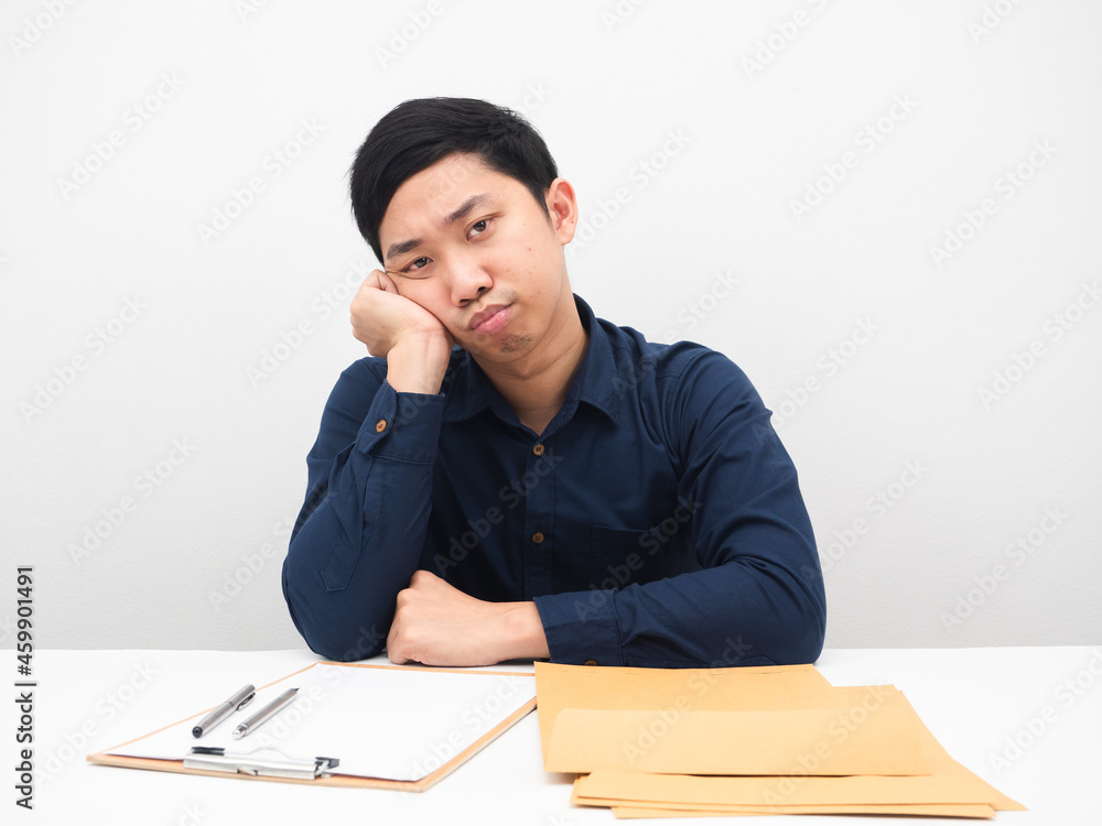 Man sit at workplace feeling bored with work white background Man sit at workplace feeling bored with work white background