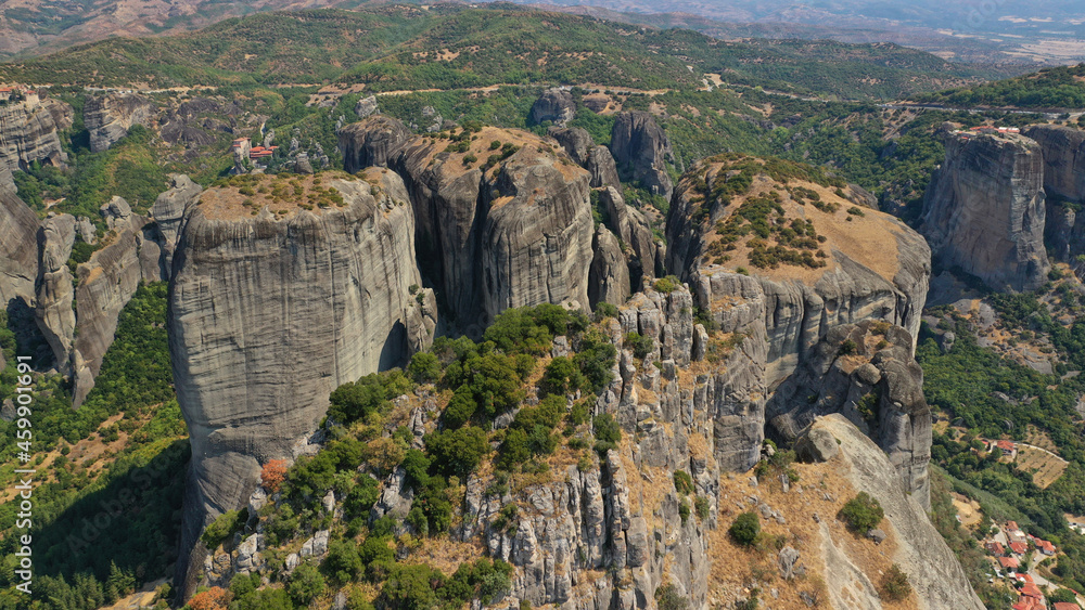 Aerial drone photo of iconic Meteora rock formation complex of immense natural pillars and hill-like rounded stones, an Unesco World Heritage site, Thessaly, Greece