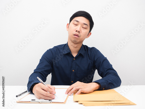 Man sleep with document envolope on the table photo