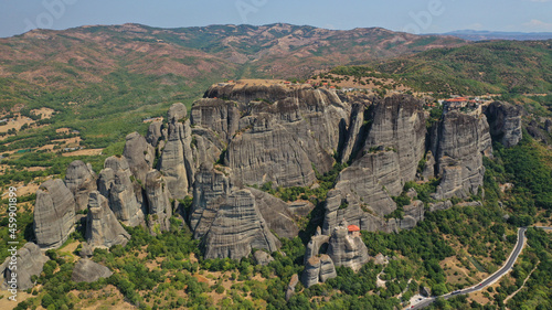 Aerial drone photo of iconic Meteora rock formation complex of immense natural pillars and hill-like rounded stones, an Unesco World Heritage site, Thessaly, Greece